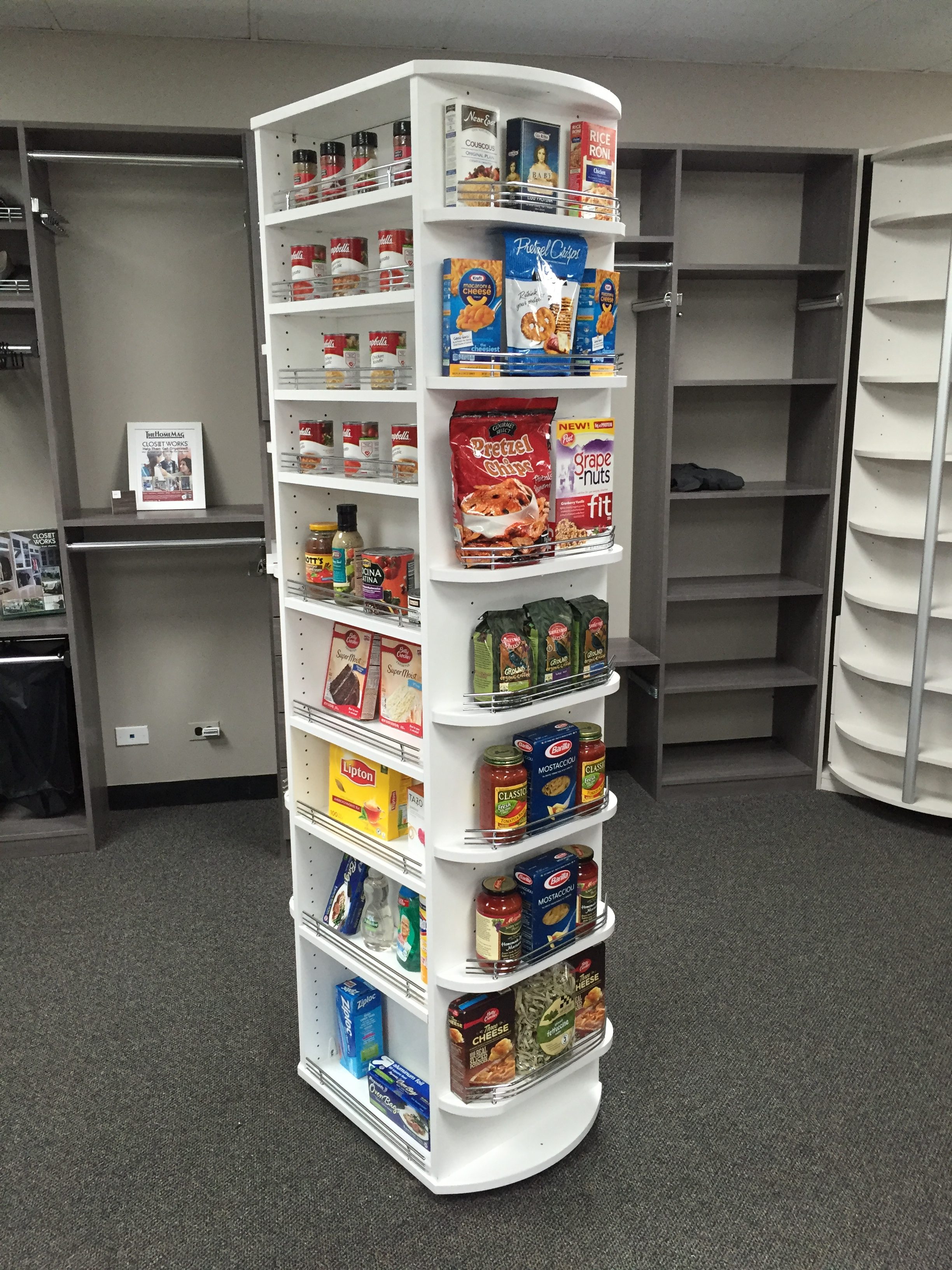 Space-saving revolving wardrobe pantry organizer in showroom