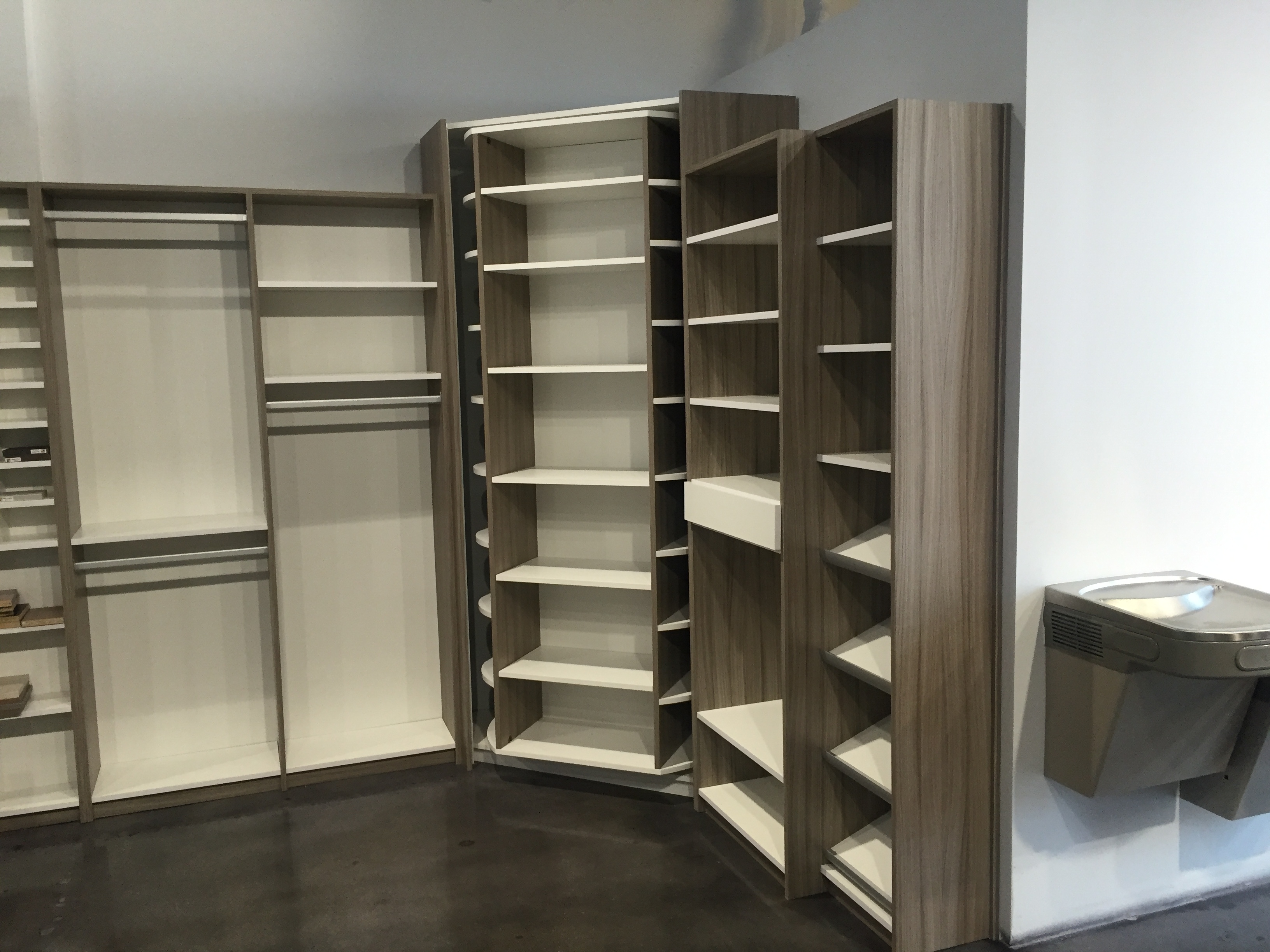Rotating closet organizer with bulk custom closet cabinetry