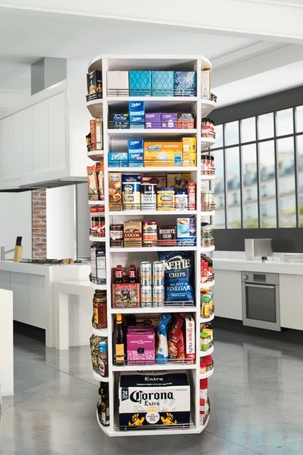 Rotating closet organizer installed in boutique-inspired walk-in closet